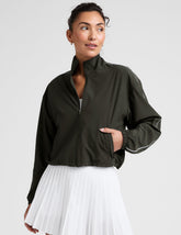 green zip-up jacket with white piping and pockets.